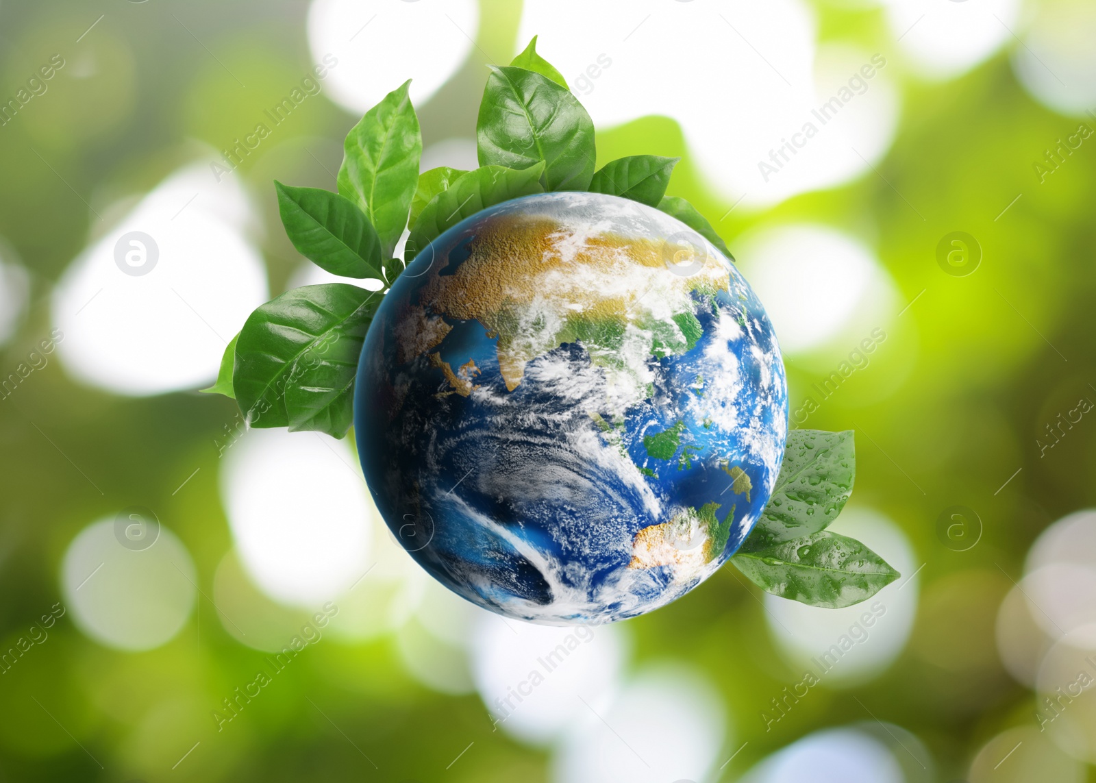 Image of Recycling concept. Earth planet with green leaves on blurred background