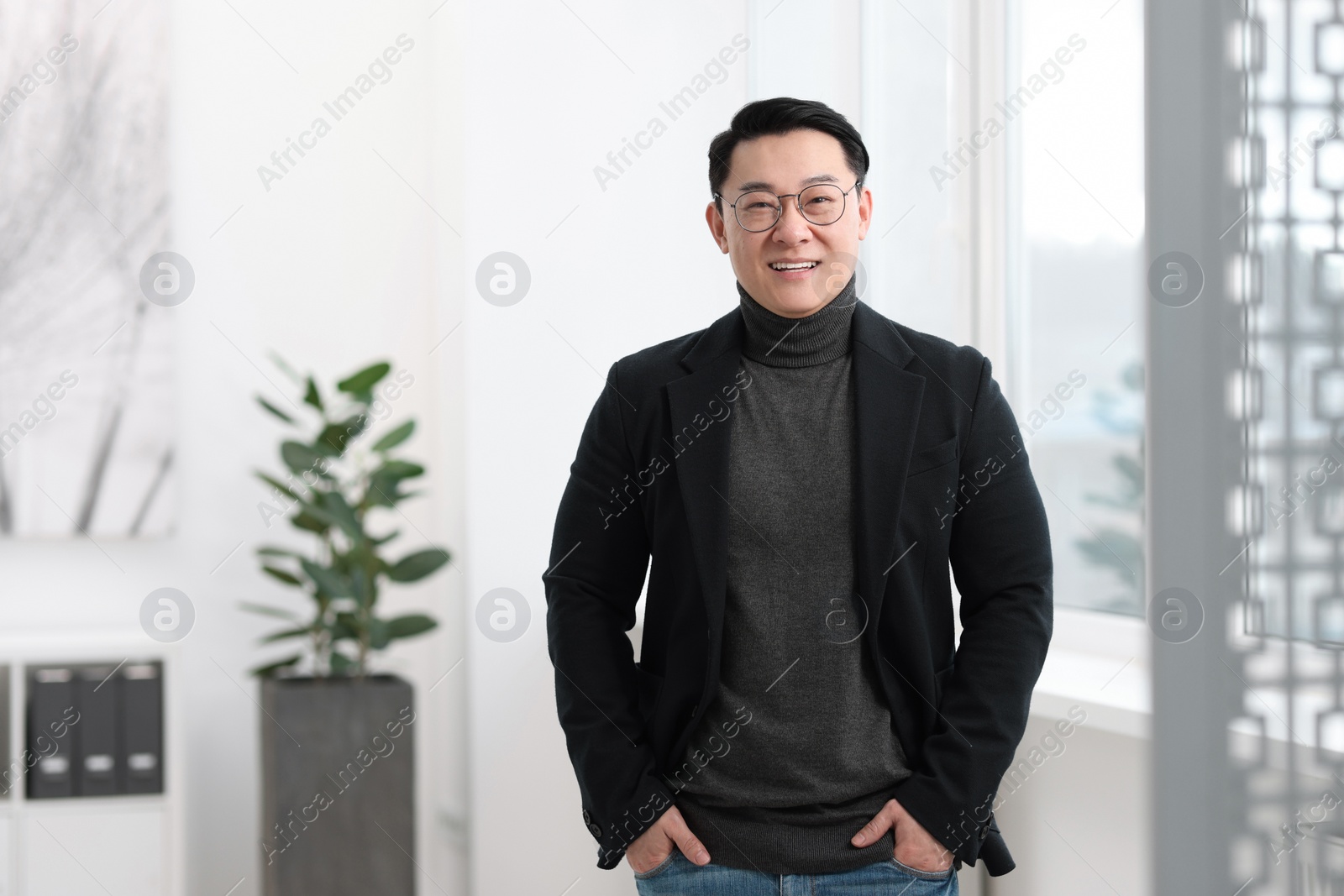 Photo of Portrait of smiling businessman in office. Space for text