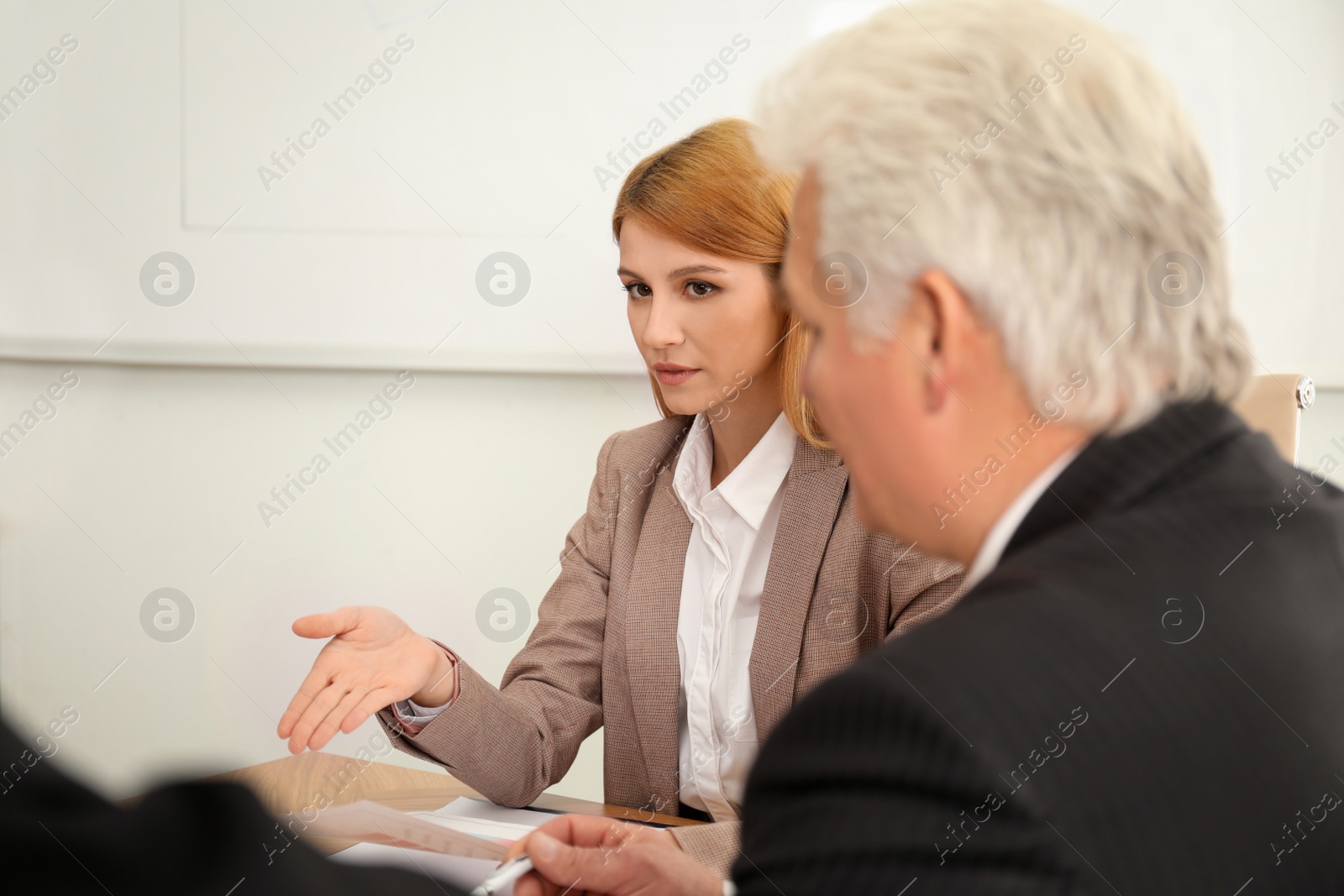 Photo of Professional business trainer working with people in office