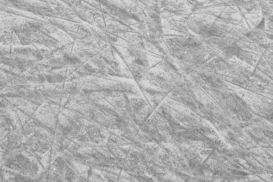 Photo of Frozen ice skating surface as background, above view. Winter season