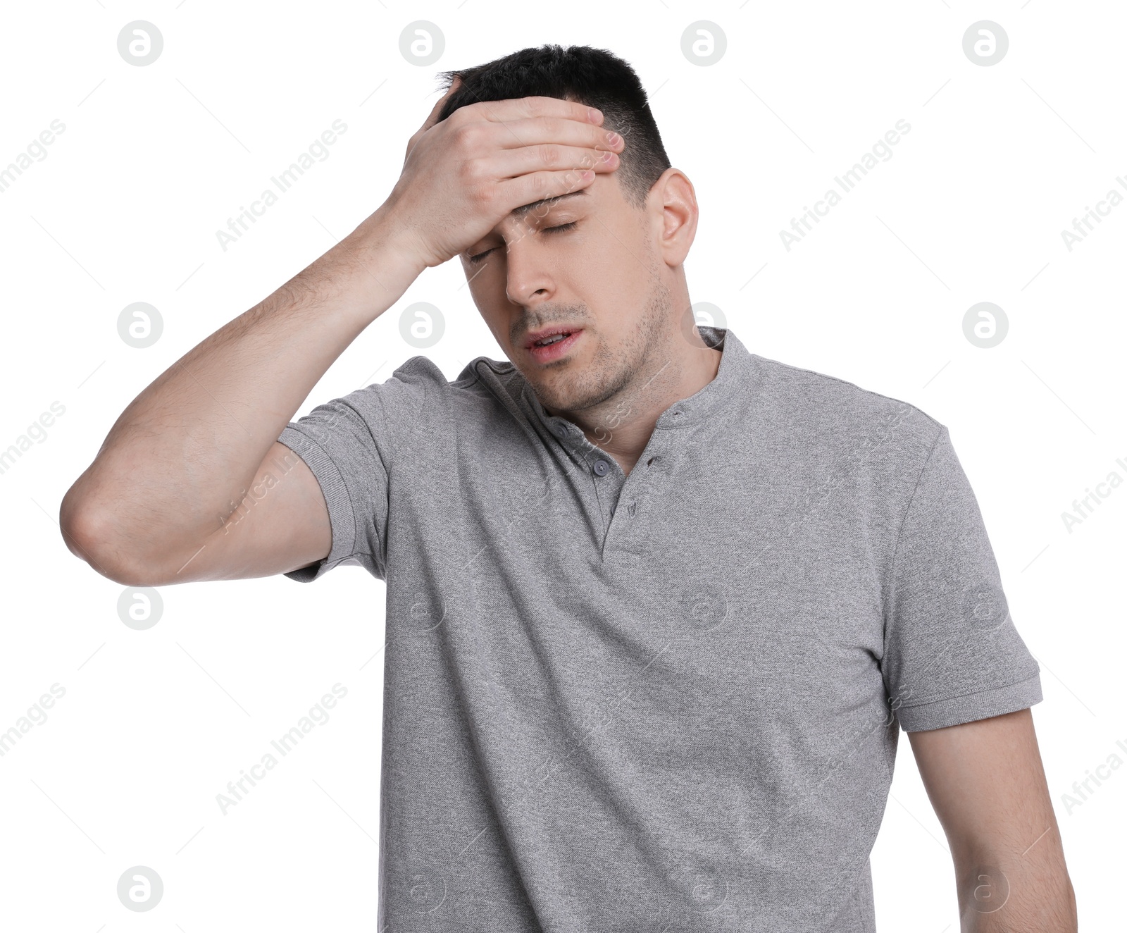 Photo of Young man suffering from headache on white background. Cold symptoms