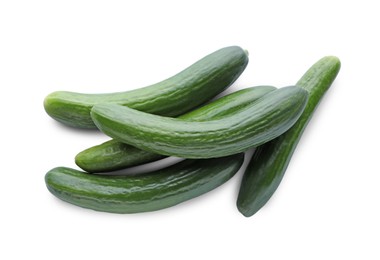 Photo of Whole fresh green cucumbers isolated on white, top view