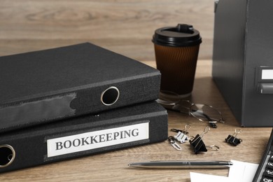 Photo of Bookkeeper's workplace with folders and documents on table