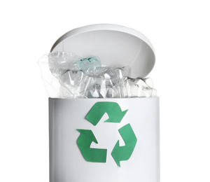 Many used bottles in trash bin isolated on white. Plastic recycling