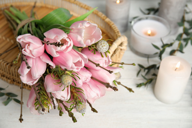 Beautiful bouquet with spring pink tulips on table, closeup