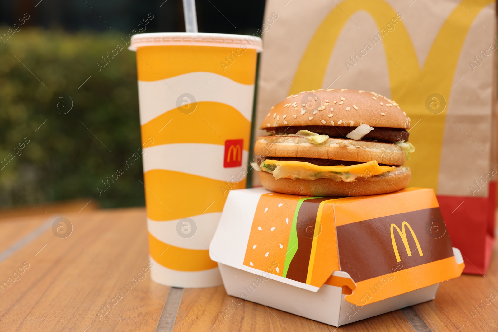 Photo of Lviv, Ukraine - October 9, 2023: McDonald's menu on wooden table outdoors