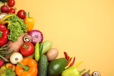 Photo of Flat lay composition with fresh vegetables on yellow background. Space for text