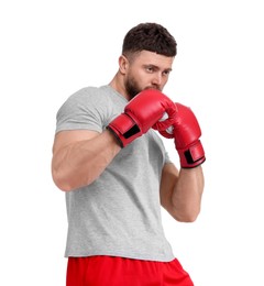 Photo of Man in boxing gloves fighting on white background