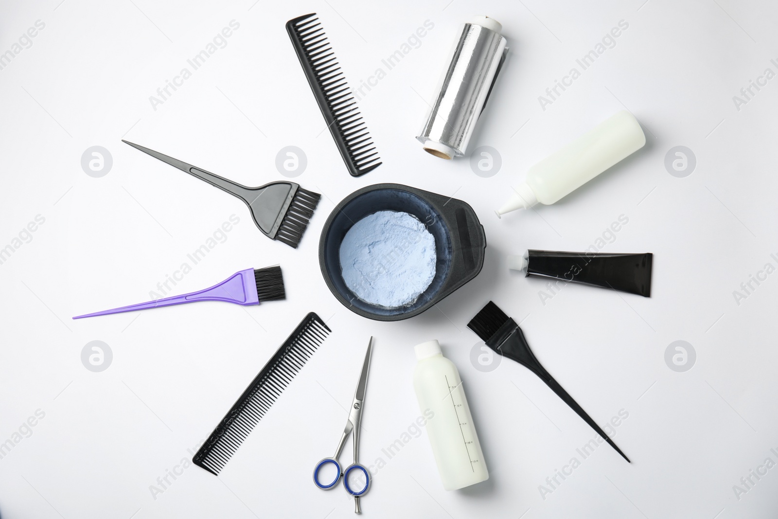 Photo of Professional tools for hair dyeing on white background, flat lay