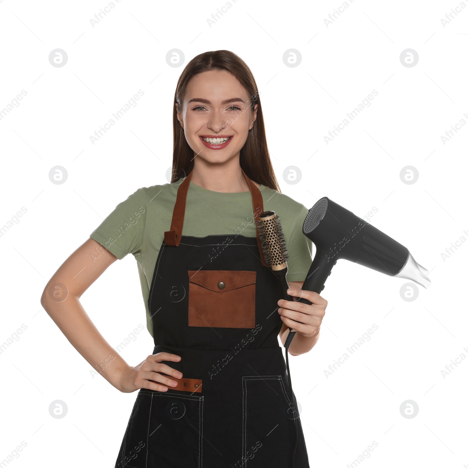 Photo of Portrait of happy hairdresser with hairdryer and round brush on white background