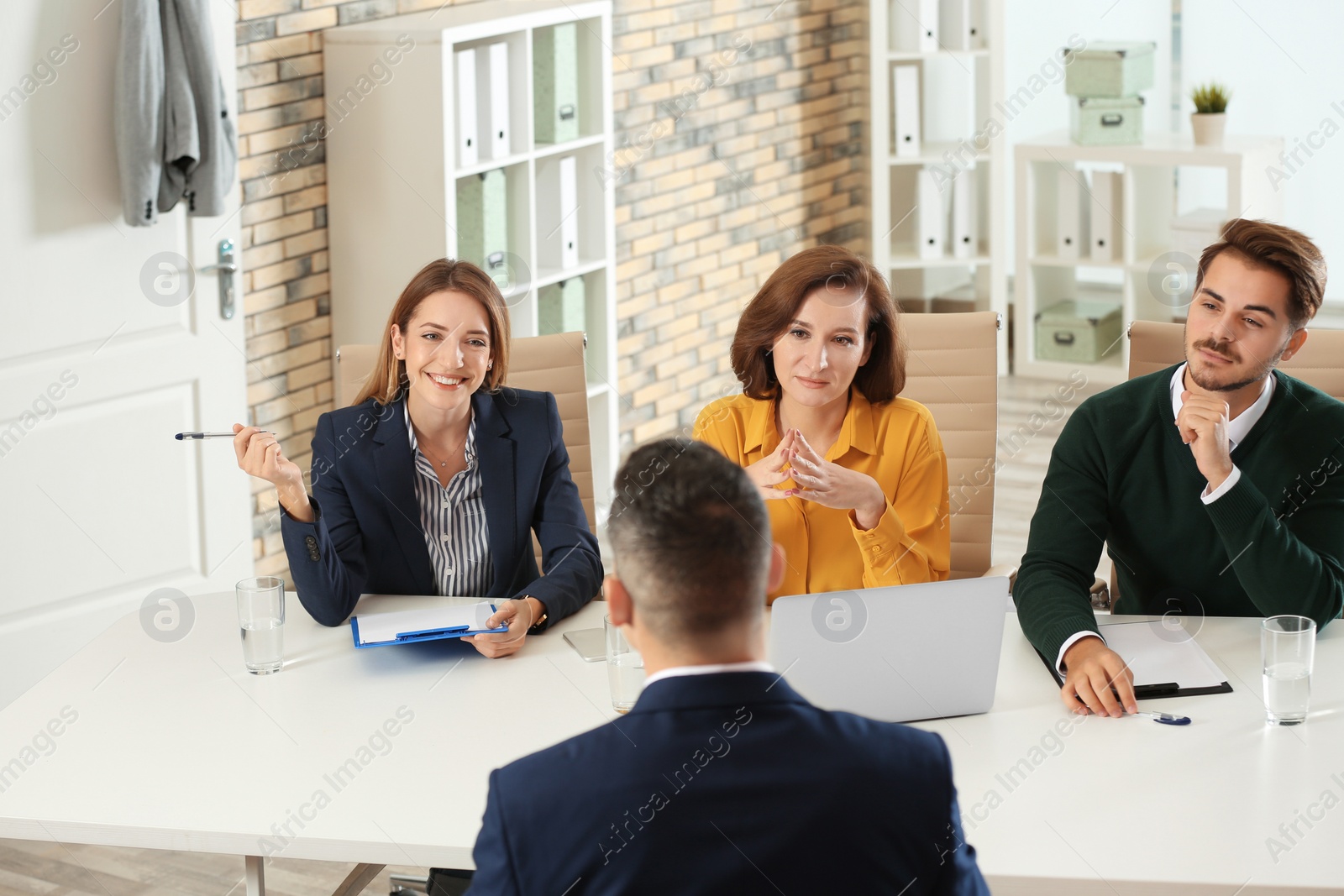 Photo of Human resources commission conducting job interview with applicant in office