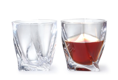 Photo of Empty and full whiskey glasses on white background