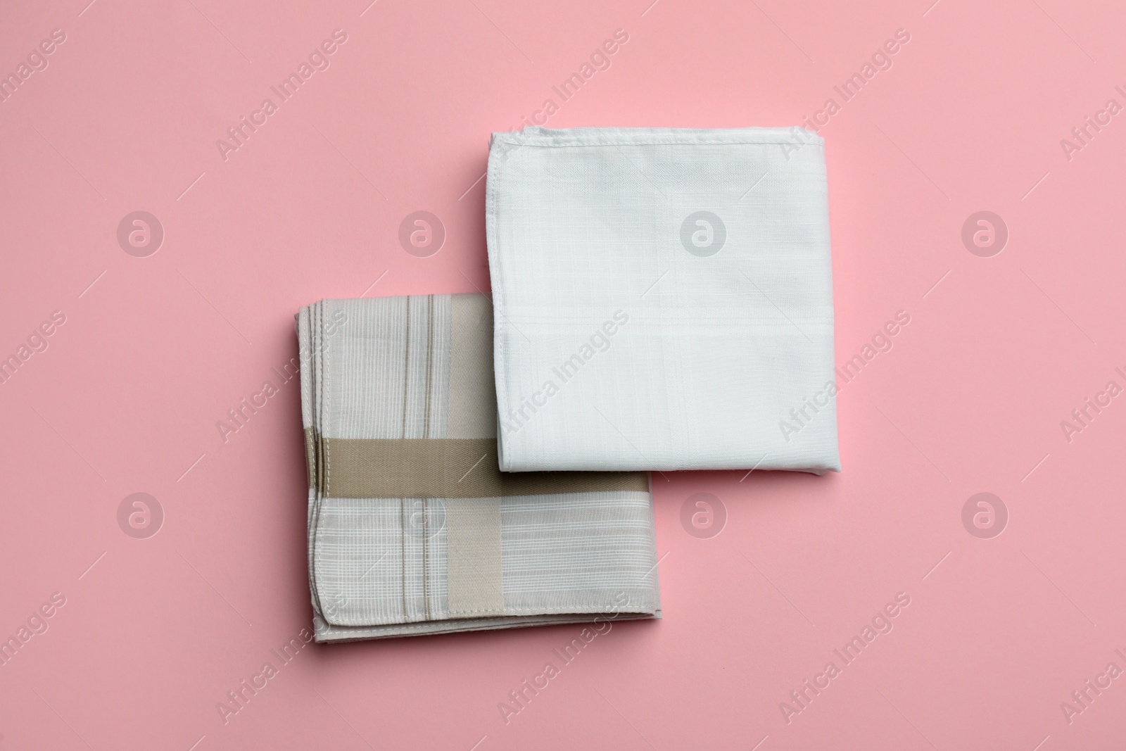 Photo of Stylish handkerchiefs on pink background, flat lay