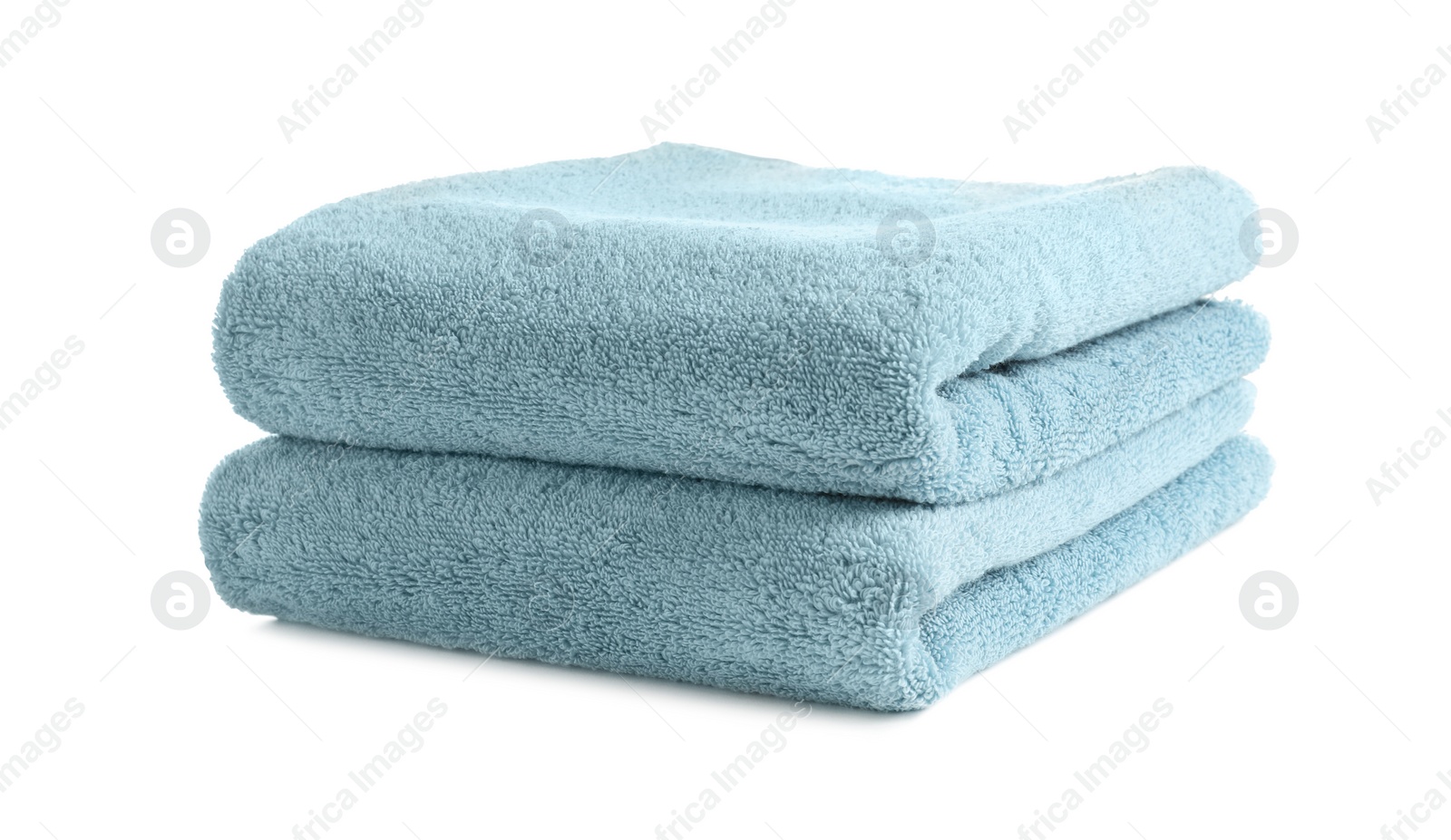 Photo of Folded clean soft towels on white background