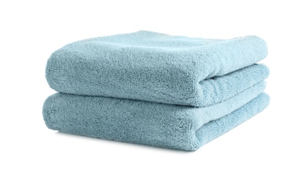 Photo of Folded clean soft towels on white background