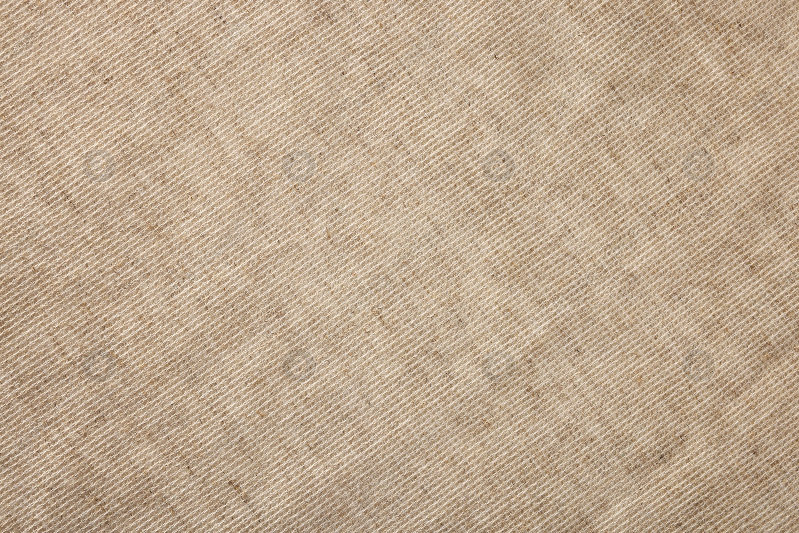 Photo of Texture of natural burlap fabric as background, top view