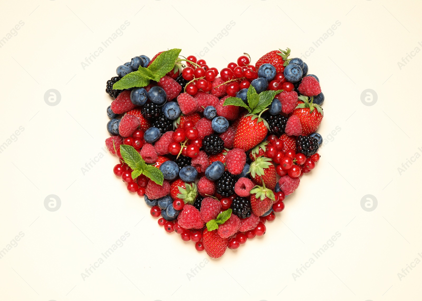 Photo of Mix of different fresh berries and mint on light background, flat lay