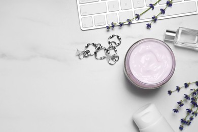 Photo of Flat lay composition with different hand care cosmetic products and lavender on white table, space for text