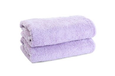 Photo of Folded violet terry towels isolated on white