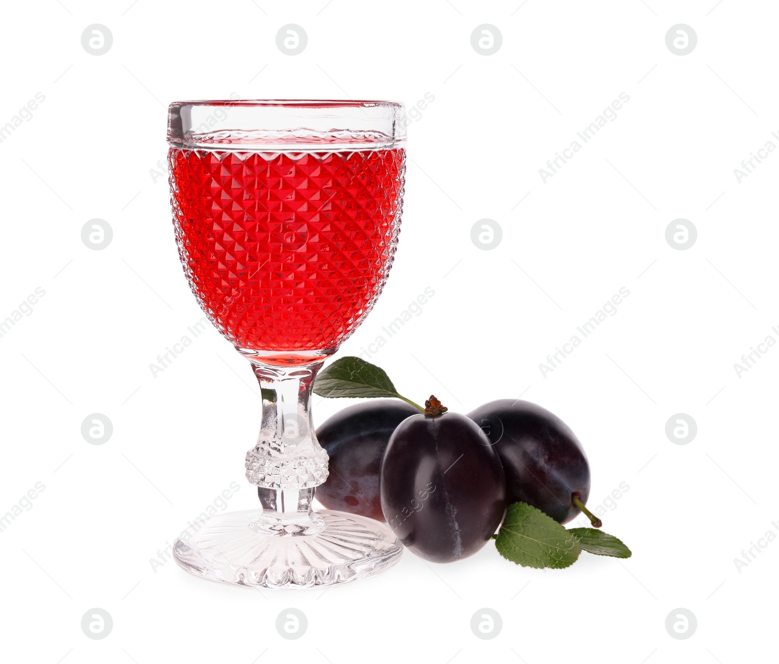 Photo of Delicious plum liquor and ripe fruits on white background. Homemade strong alcoholic beverage