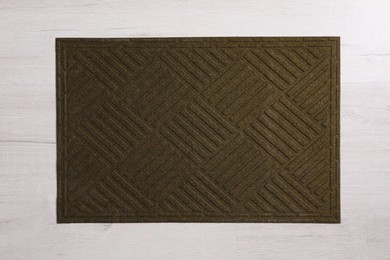 Photo of New clean door mat on floor, top view