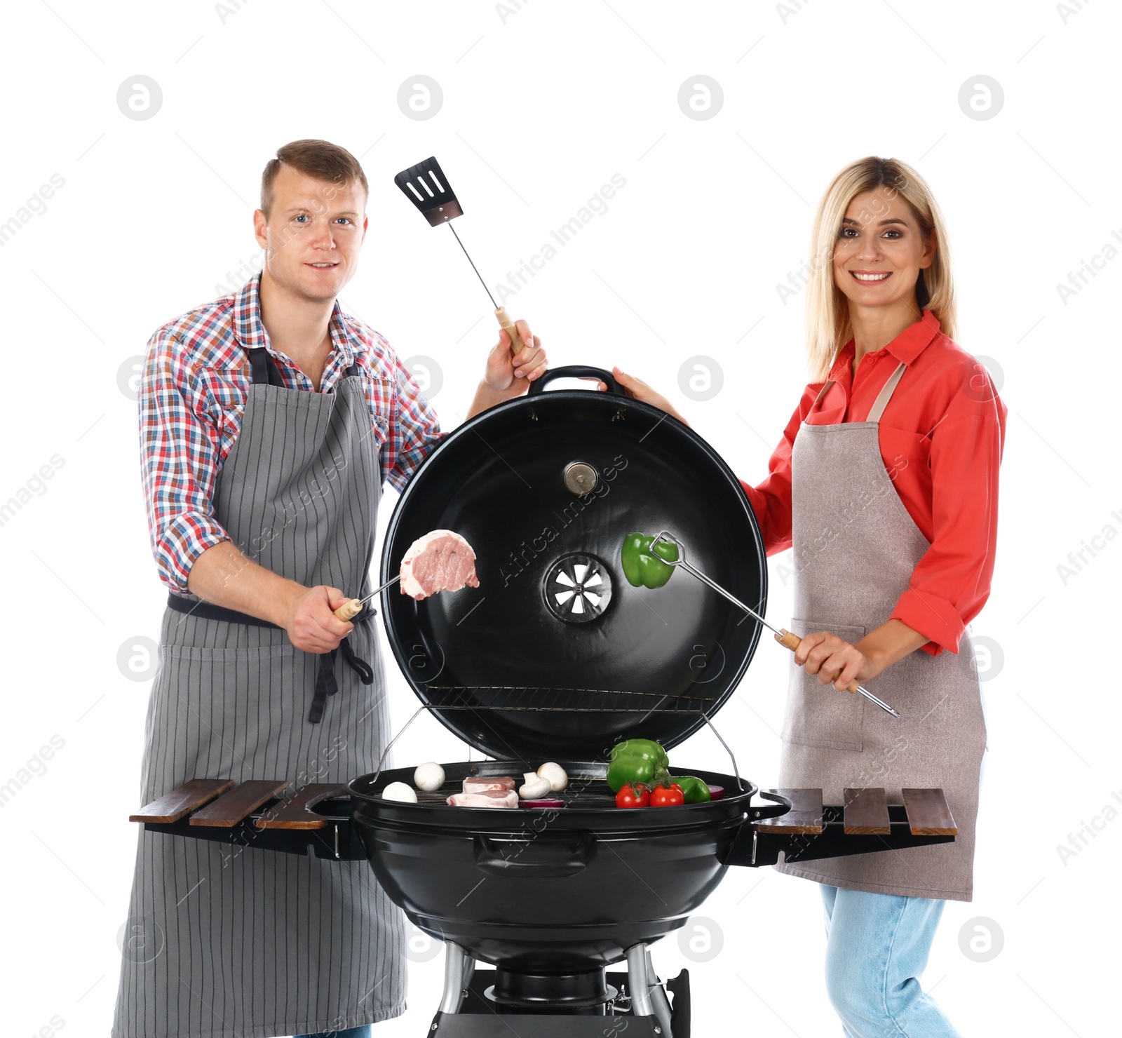 Photo of Happy couple cooking on barbecue grill, white background