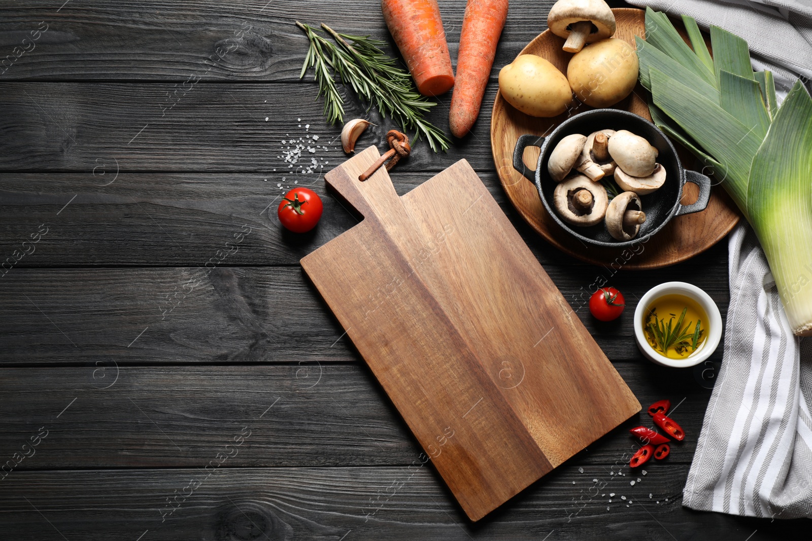 Photo of Flat lay composition with fresh products on black wooden table, space for text. Healthy cooking