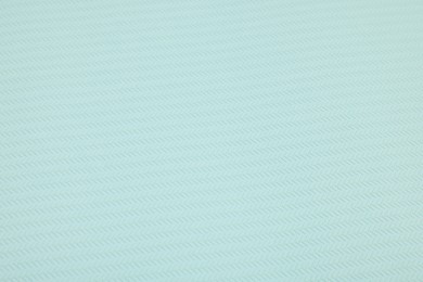 Stylish light turquoise wallpaper as background, closeup