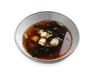 Photo of Bowl of delicious miso soup with tofu isolated on white