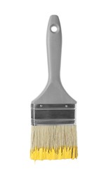 Photo of One brush with yellow paint isolated on white