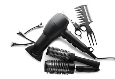 Photo of Different professional hairdresser tools on white background, top view