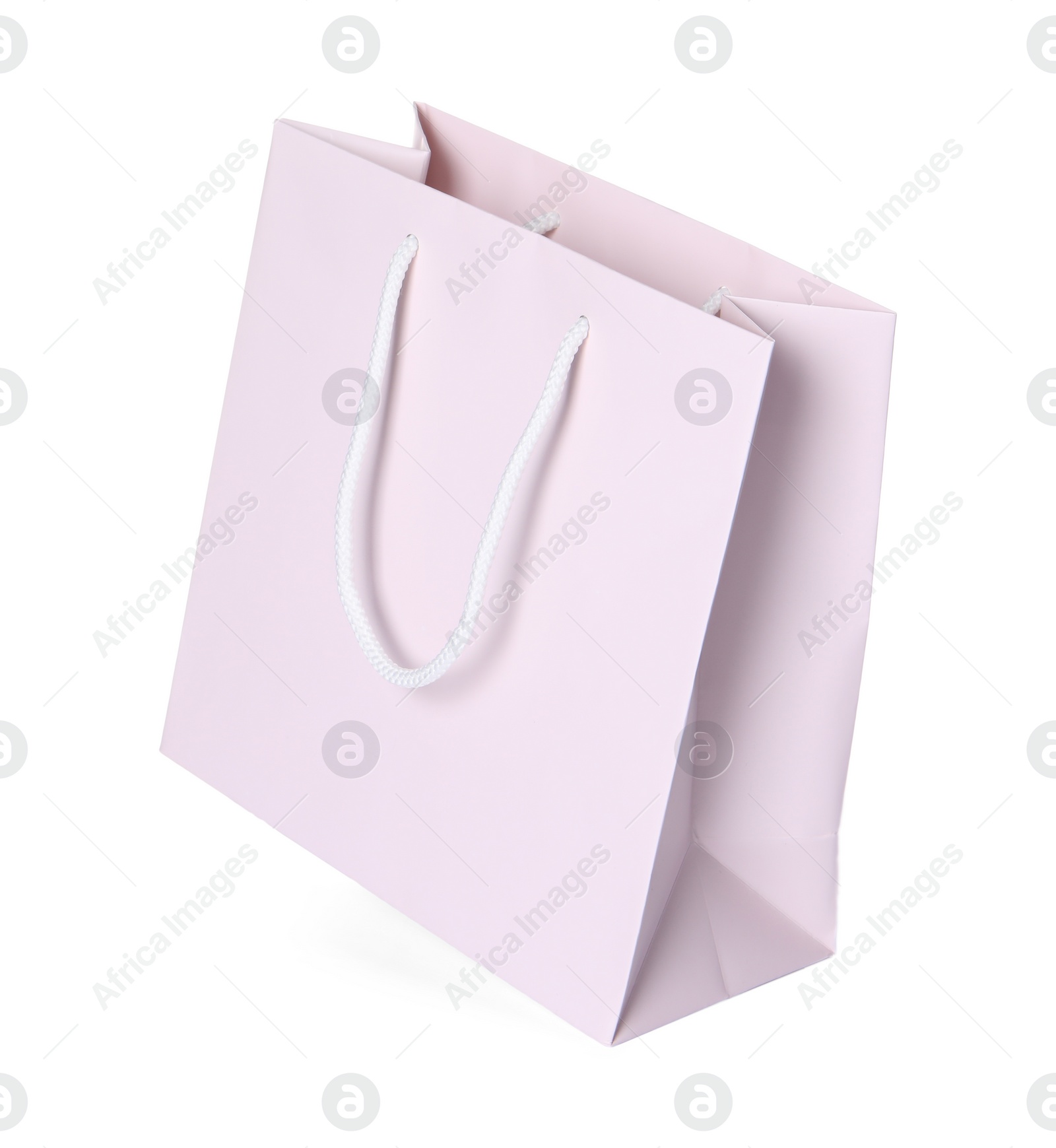 Photo of One paper shopping bag isolated on white