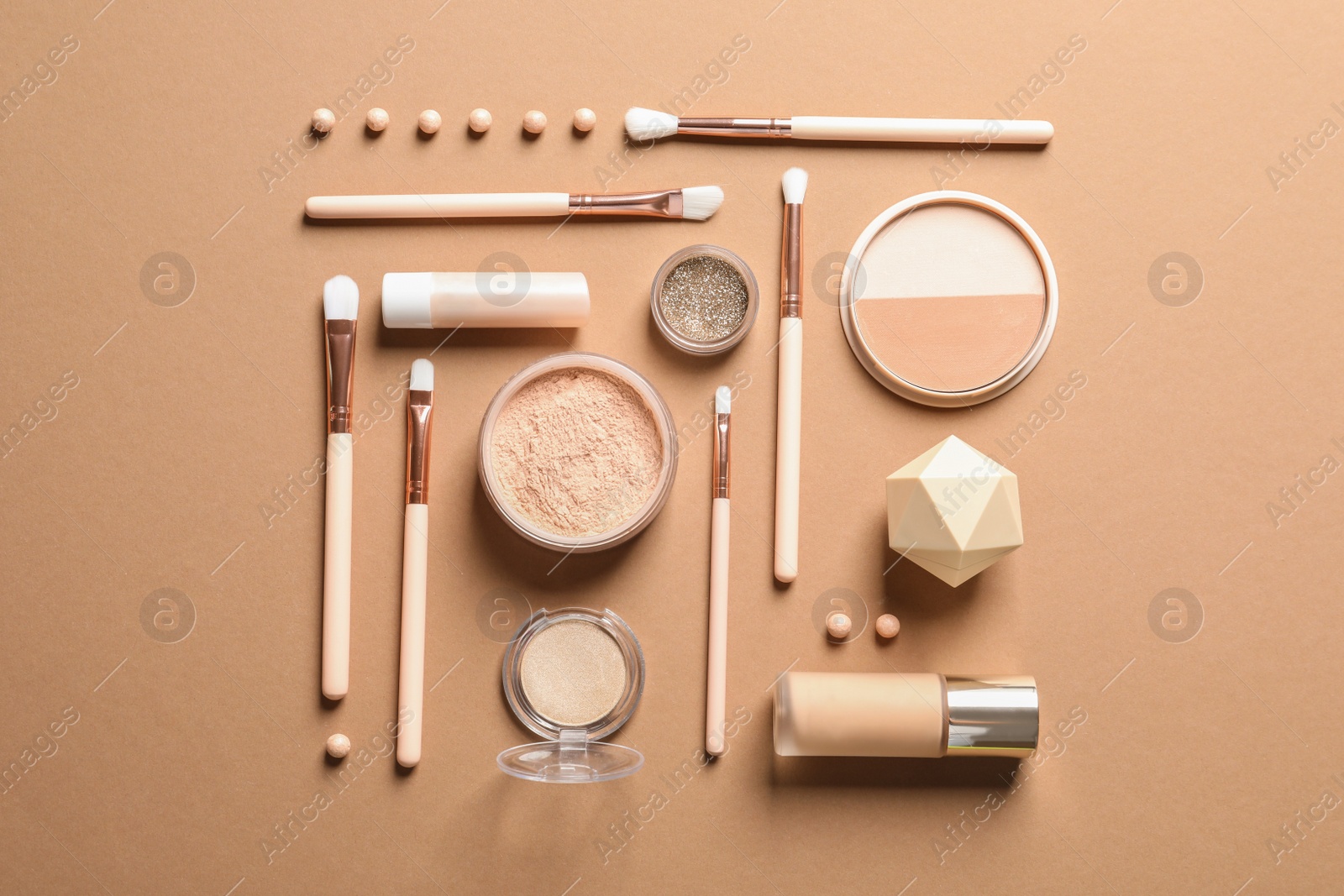 Photo of Flat lay composition with makeup brushes on brown background