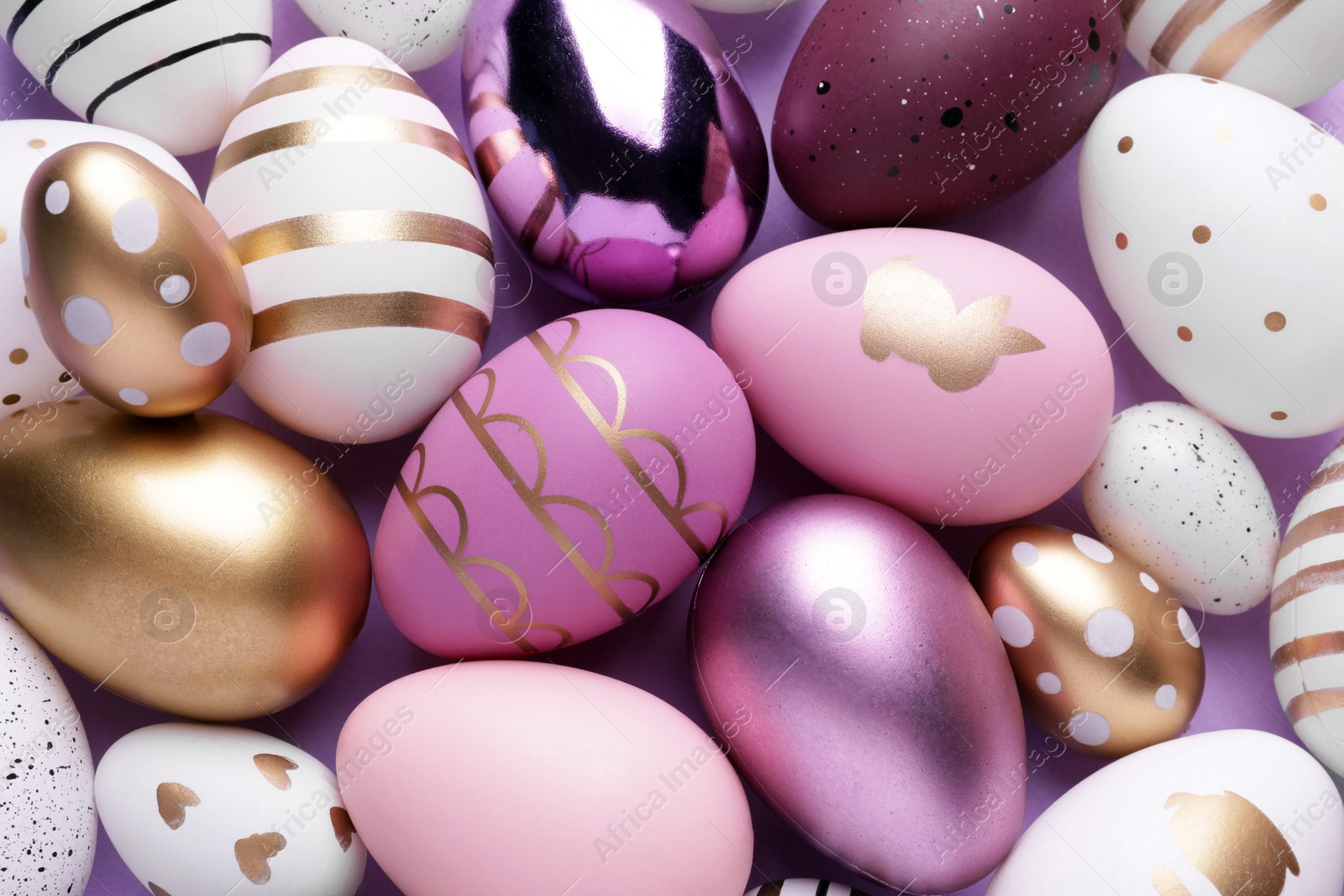 Photo of Beautifully painted Easter eggs as background, top view