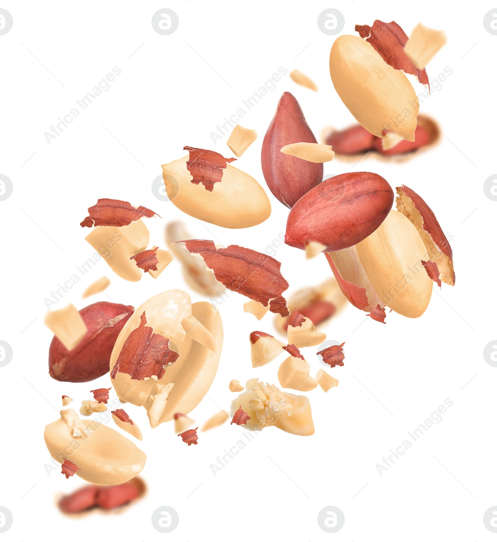 Image of Unpeeled peanuts in air on white background