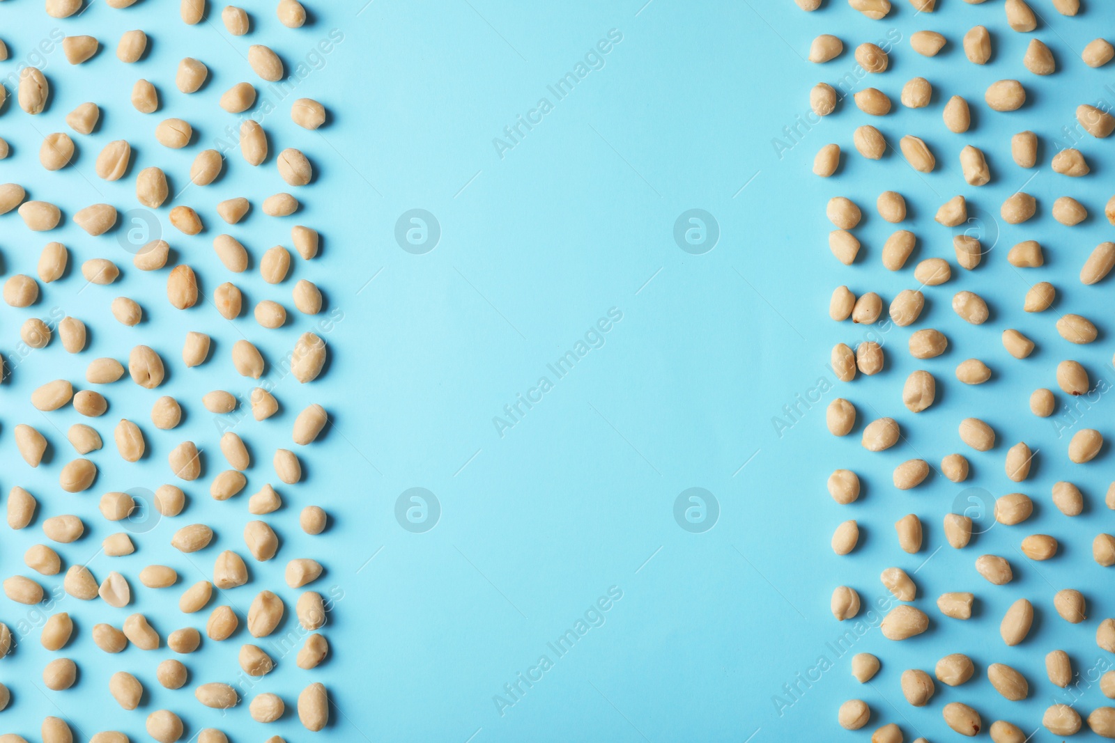 Photo of Composition with peanuts and space for text on color background, top view