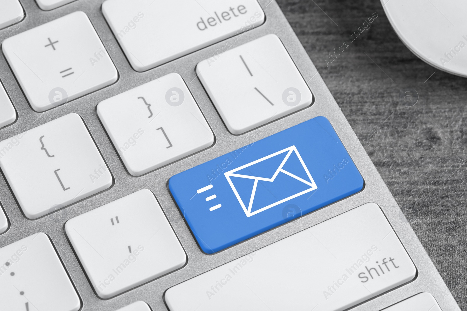 Image of Modern computer keyboard with envelope sign on button, closeup view. Sending email letters