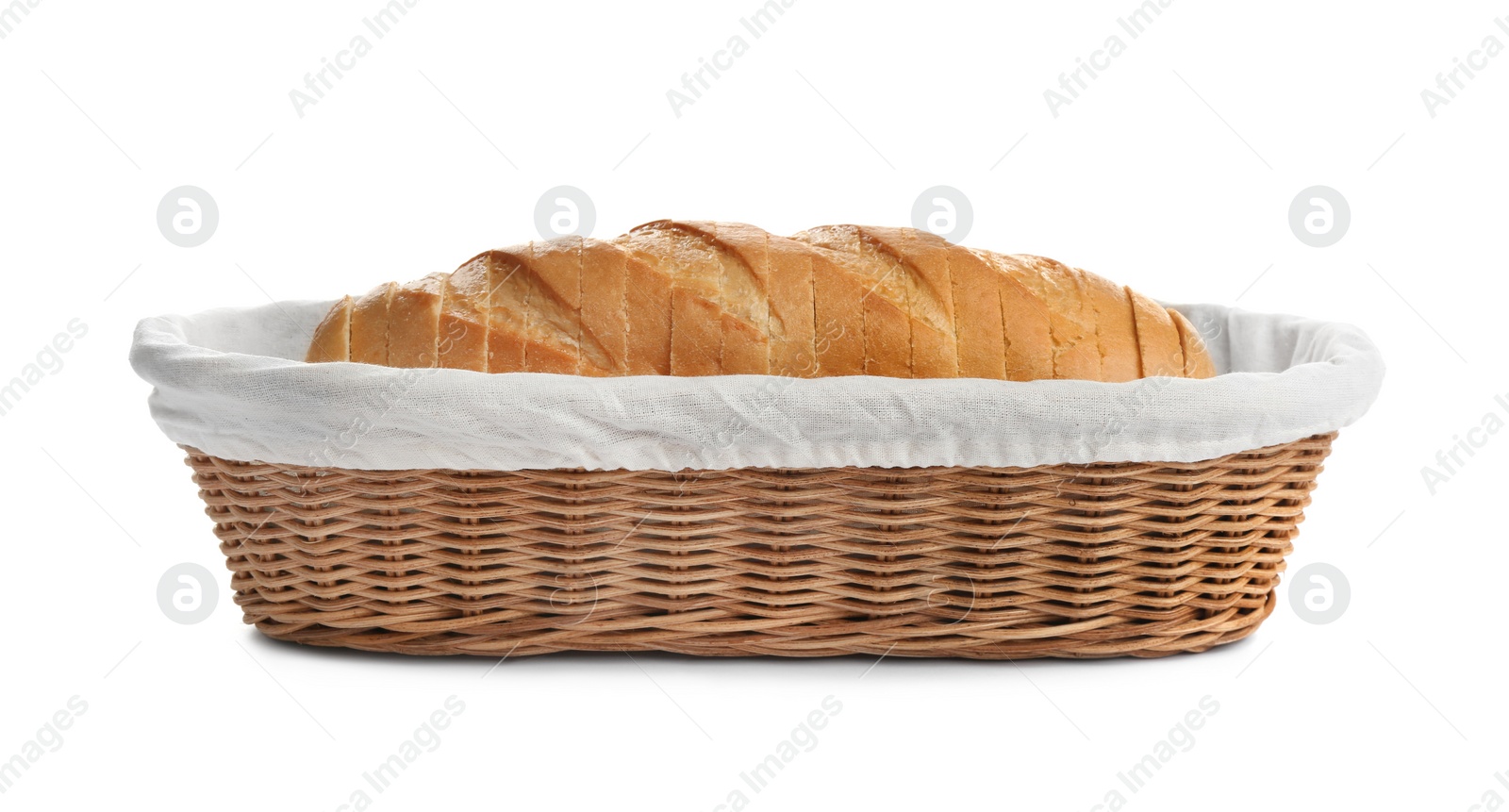 Photo of Sliced tasty fresh bread in wicker basket on white background