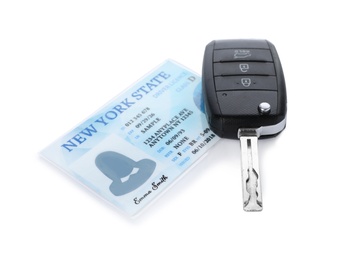 American driving license and car key on white background