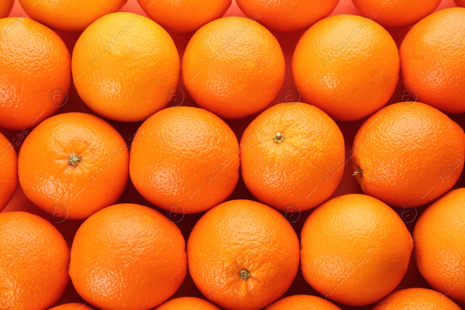 Photo of Fresh ripe oranges as background, top view