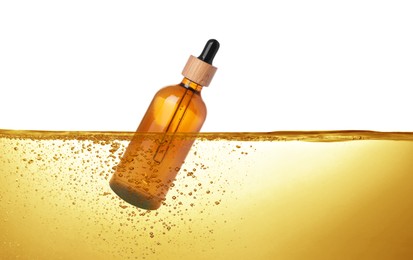 Image of Bottle of cosmetic product floating in essential oil against white background