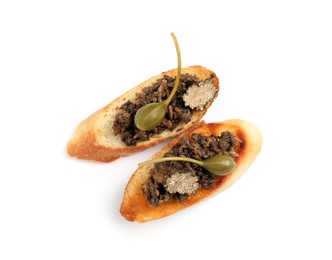 Tasty bruschettas with truffle paste and capers on white background, top view
