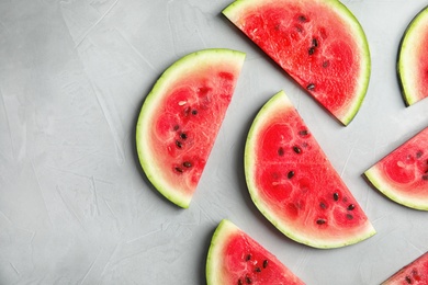 Photo of Flat lay composition with watermelon slices on grey background