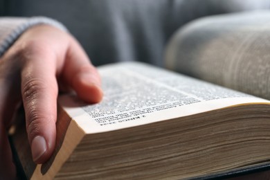Photo of Woman with old holy Bible, closeup view
