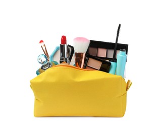 Photo of Stylish yellow cosmetic bag with makeup products on white background