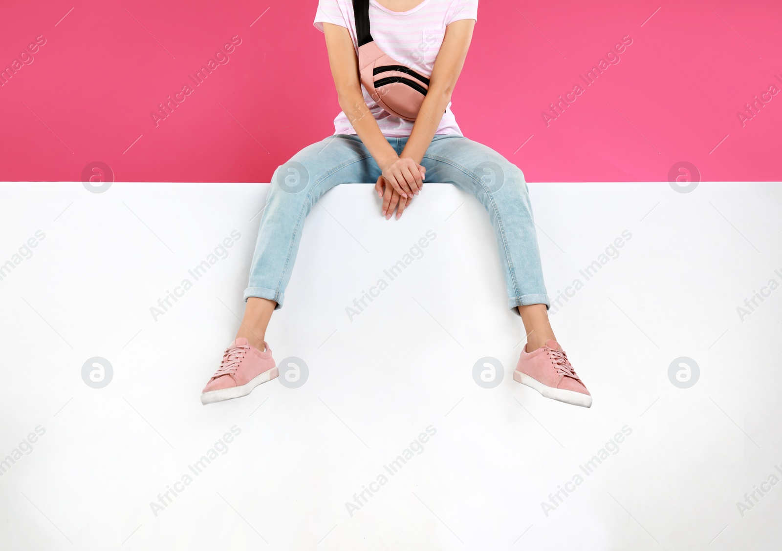 Photo of Woman wearing stylish shoes on color background, closeup