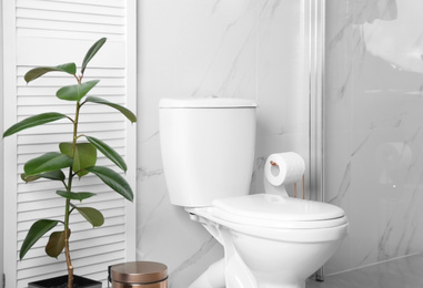 Ceramic toilet bowl in modern bathroom interior