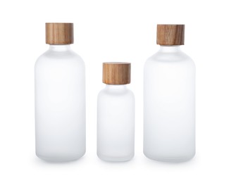 Bottles of essential oil on white background