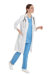 Photo of Doctor in clean uniform walking on white background