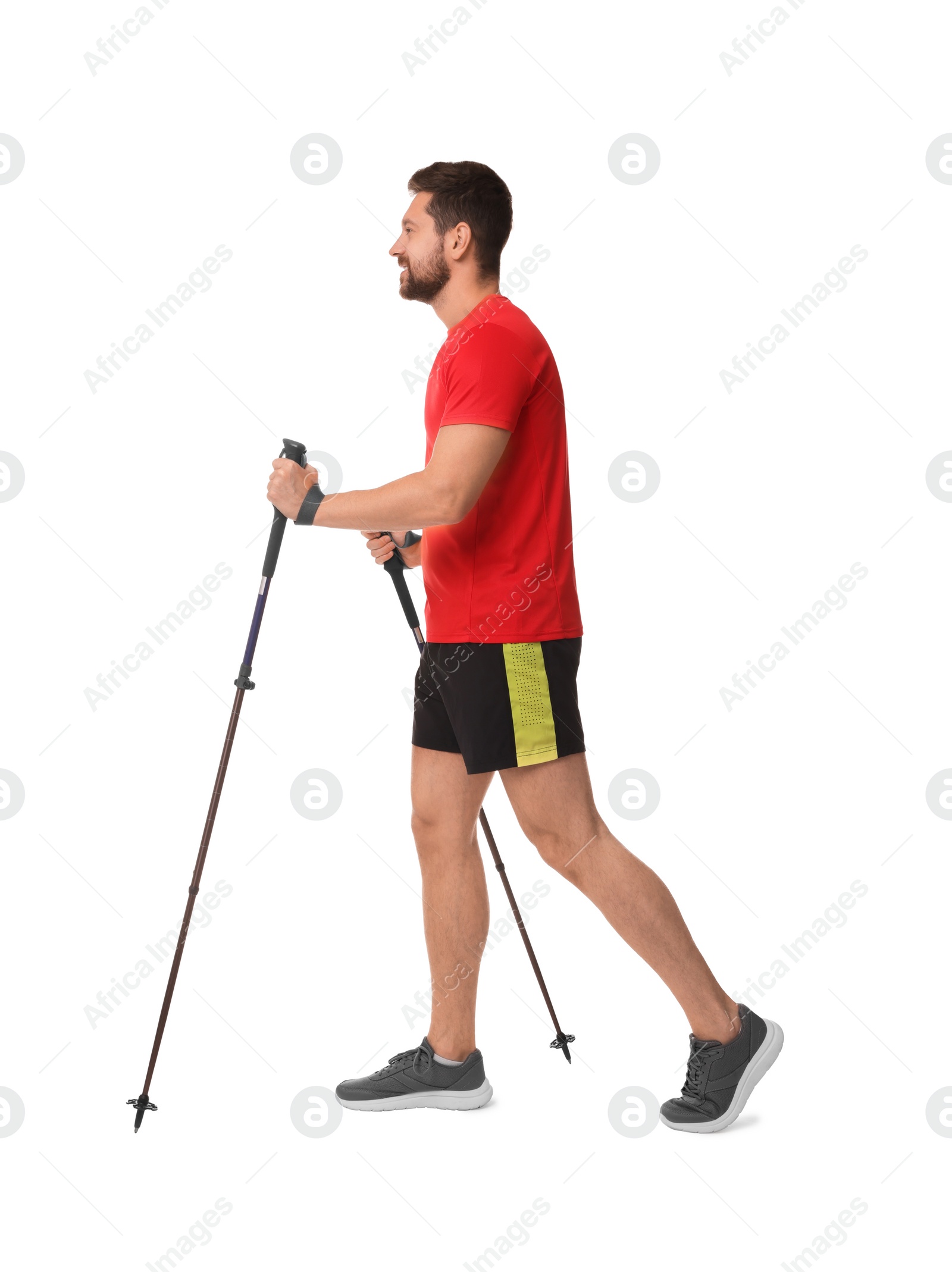 Photo of Man practicing Nordic walking with poles isolated on white